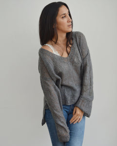 Women wearing knitted grey mohair sweater made using KNIT SAFARI Nebelung Knit pattern
